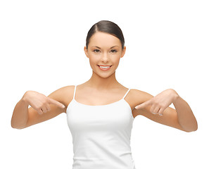 Image showing woman in blank white t-shirt pointing at herself