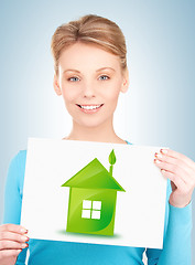 Image showing woman with illustration of green eco house