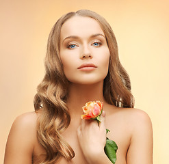 Image showing lovely woman with rose flower