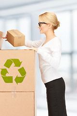 Image showing attractive businesswoman with big boxes