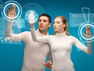 Image showing man and woman working with virtual screens