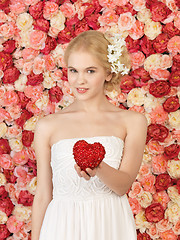 Image showing woman with heart and background full of roses