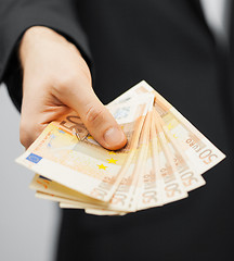 Image showing man in suit with euro cash money