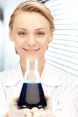 Image showing lab worker holding up test tube