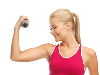 Image showing young sporty woman with light dumbbell