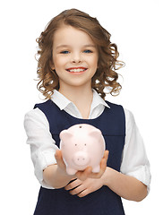 Image showing girl with piggy bank