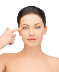 Image showing beautiful woman touching her eye area