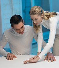 Image showing man and woman working with something