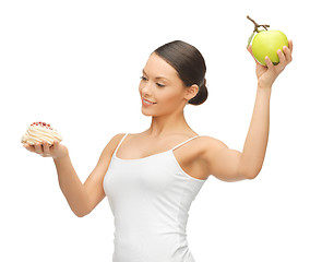 Image showing woman with cake and apple