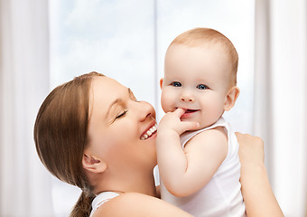 Image showing happy mother with adorable baby