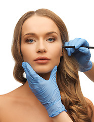 Image showing woman face and beautician hands