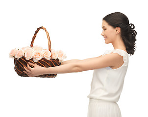 Image showing woman with basket full of flowers