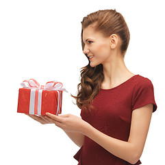 Image showing teenage girl in red dress with gift box