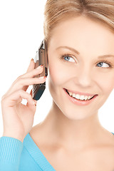 Image showing businesswoman with cell phone calling