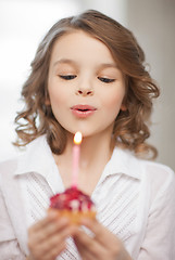 Image showing girl with cupcake