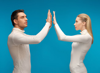 Image showing man and woman working with something imaginary