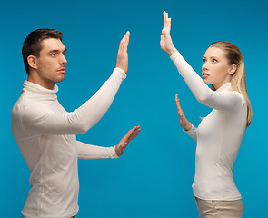 Image showing man and woman working with something imaginary