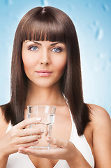 Image showing woman holding a glass of water