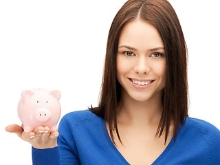 Image showing lovely woman with piggy bank