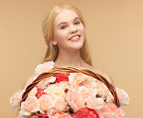 Image showing woman with basket full of flowers