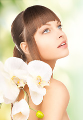 Image showing beautiful woman with orchid flower