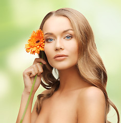 Image showing lovely woman with gerbera flower