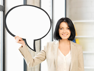 Image showing smiling businesswoman with blank text bubble