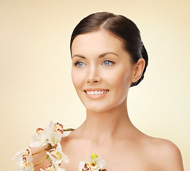 Image showing lovely woman with orchid flower