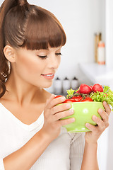 Image showing woman in the kitchen with tomatoes