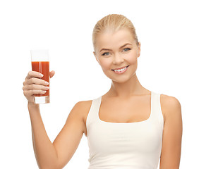 Image showing woman holding glass of tomato juice