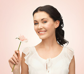 Image showing young and beautiful woman with flower