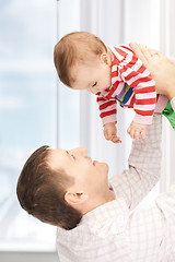 Image showing happy father with adorable baby