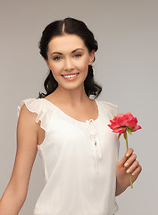 Image showing young and beautiful woman with flower