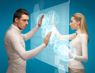 Image showing man and woman working with virtual screens