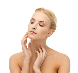 Image showing woman touching her face skin