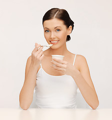 Image showing woman with yogurt