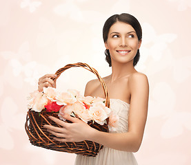 Image showing woman with basket full of flowers