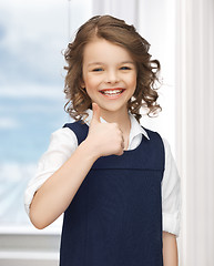 Image showing pre-teen girl showing thumbs up