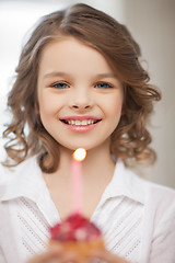 Image showing girl with cupcake