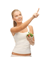 Image showing healthy woman holding bowl with salad