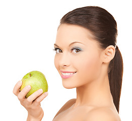 Image showing smiling woman in with an apple