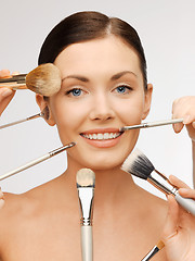 Image showing beautiful woman with brushes