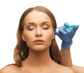 Image showing woman face and beautician hands