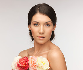 Image showing relaxed woman with flowers