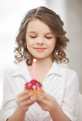 Image showing girl with cupcake