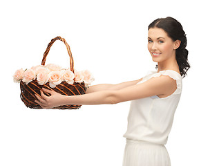 Image showing woman with basket full of flowers