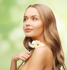 Image showing lovely woman with gerbera flower