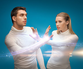 Image showing man and woman working with magic