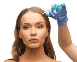 Image showing woman face and beautician hands