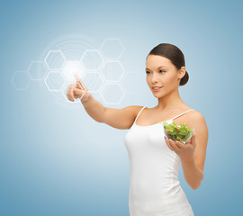 Image showing woman with salad and virtual screen